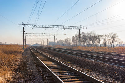 Railroad tracks against clear sky