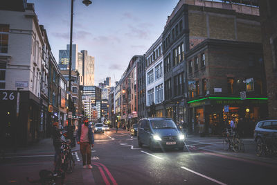 City street amidst buildings against sky