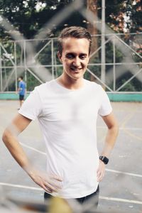 Portrait of young man standing outdoors
