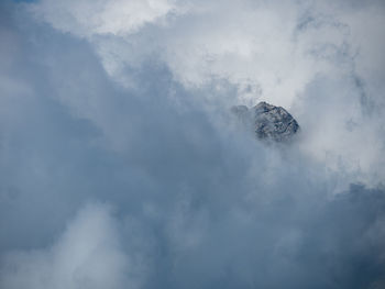 Low angle view of smoke stack against sky