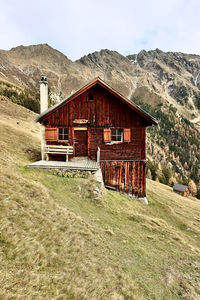 House on field against sky