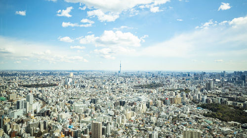 High angle view of city against cloudy sky