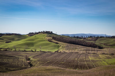 Scenic view of farm against sky