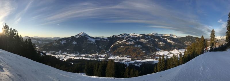 Scenic view of snowcapped mountains against sky during winter