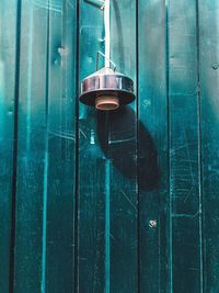 Close-up of lighting equipment hanging on wall