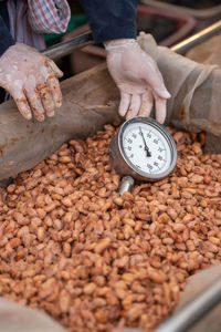 Midsection of man holding food at market stall