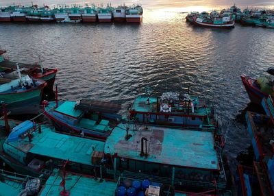 High angle view of boats moored at harbor