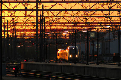 Train at railroad station against sky