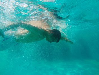People swimming in sea