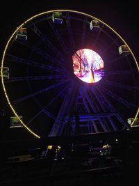 Low angle view of illuminated ferris wheel