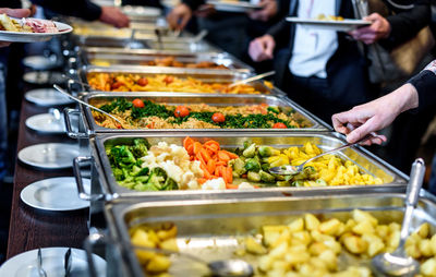 Cropped image of hand taking food