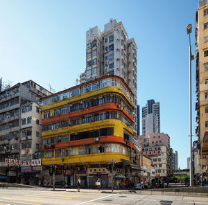 View of buildings in city against clear sky