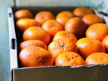 Close-up of oranges in crate