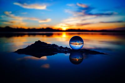 Scenic view of lake against sky during sunset