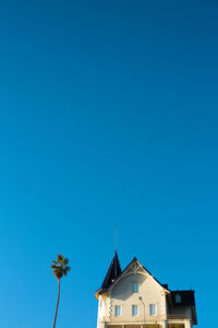 Low angle view of building against blue sky