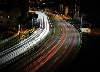 High angle view of light trails on road at night