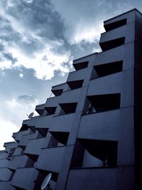 Low angle view of building against cloudy sky