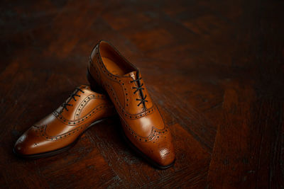 High angle view of shoes on wooden floor