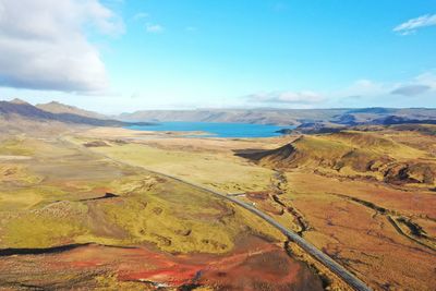 Scenic view of landscape against cloudy sky