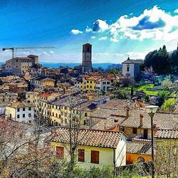 Townscape against cloudy sky