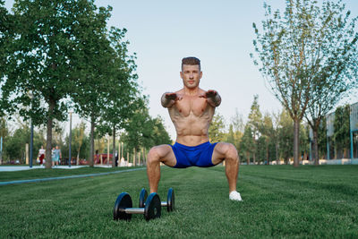 Full length of man exercising in park