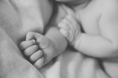 Close-up of baby boy on bed