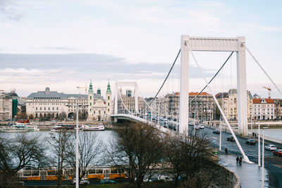 Bridge over river with city in background