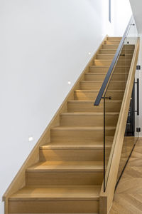 Wooden stair case with railing