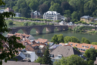 View of townscape by river in town