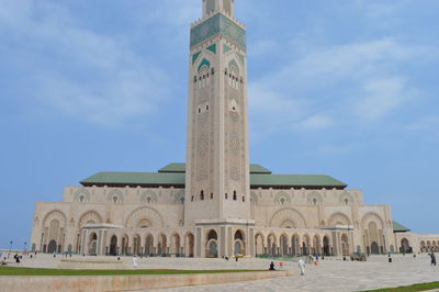 Low angle view of mosque against blue sky