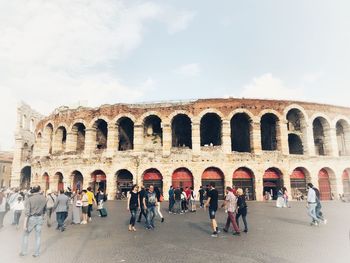 Group of people in front of historical building