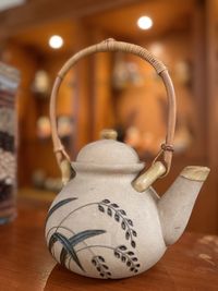 Close-up of teapot on table