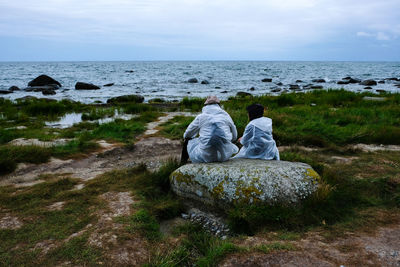 Scenic view of rocks on beach against sky