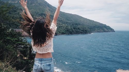 Rear view of woman in swimming pool