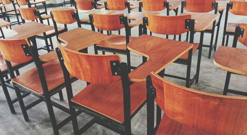 High angle view of empty chairs and table