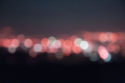 Defocused image of illuminated lights at night