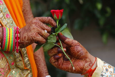 Close-up of woman holding flowers