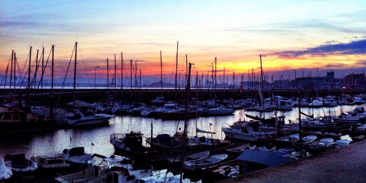 sunset, water, nautical vessel, moored, sky, boat, transportation, sea, mode of transport, orange color, harbor, cloud - sky, nature, scenics, tranquility, tranquil scene, beauty in nature, sailboat, marina, no people