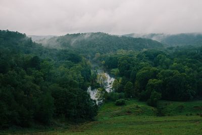 Scenic view of river with mountains in background