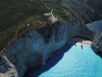 High angle view of rocks on sea shore