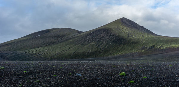 Scenic view of volcanic mountain against sky