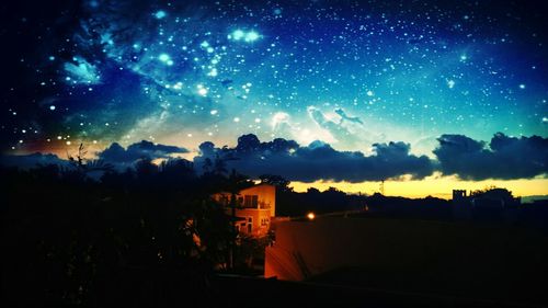 Scenic view of landscape against sky at night