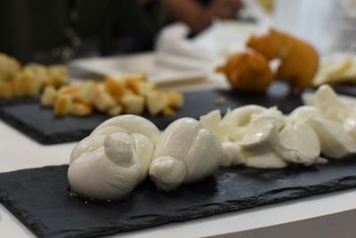 Close-up of fruits in plate on cutting board