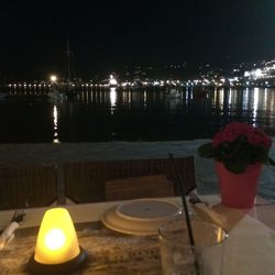 Reflection of illuminated lights in puddle