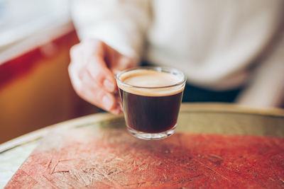 Close-up of coffee cup on table