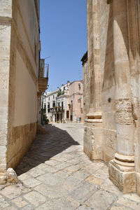 A small street in casamassima, a village with blue-colored houses in the puglia region of italy.