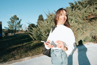 Young woman using mobile phone