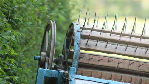 Close-up of metallic railing on field