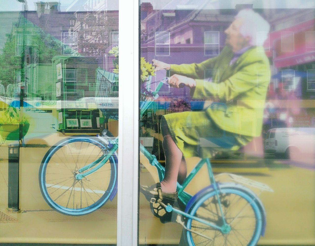 LOW SECTION OF MAN WITH BICYCLE ON CITY