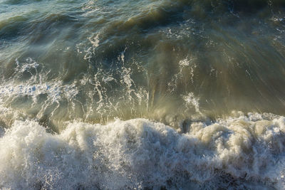 High angle view of waves splashing in sea